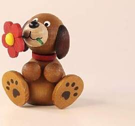Ulrich Kunsthandwerk Holztier Hund Lumpi mit Blume 